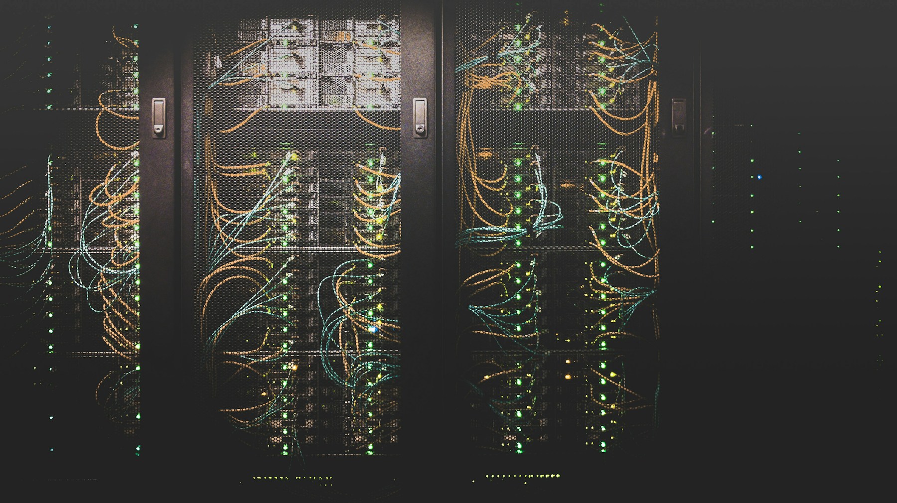 Server cabinets with connected cables and indicator lights
